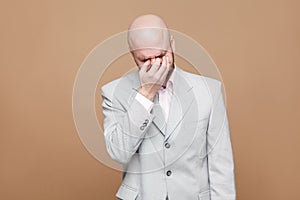 Portrait of sad depressed middle aged bald bearded businessman i