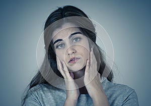 Portrait of sad and depressed woman. Isolated in white background. Human expressions and emotions