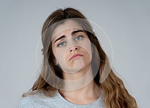 Portrait of sad and depressed woman. Isolated in white background. Human expressions and emotions