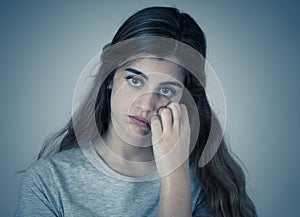 Portrait of sad and depressed woman. Isolated in white background. Human expressions and emotions