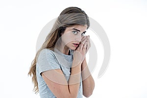 Portrait of sad and intimidated woman. Isolated in white background. Human expressions and emotions