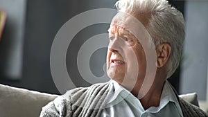 Portrait of sad senior retired man, lonely grandfather, depressed looking, very upset