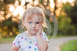 Portrait of sad serious baby