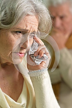 Portrait of sad stressed senior woman crying