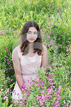 Portrait of sad teen girl on nature summer