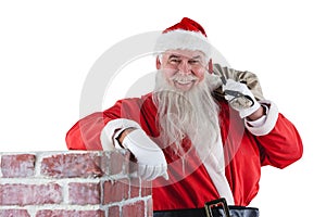 Portrait of santa Claus carrying bag full of gifts