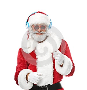 Portrait of Santa Claus listening to music and dancing on white background