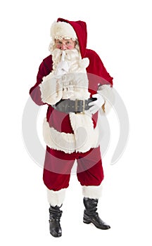 Portrait Of Santa Claus Making Silence Gesture