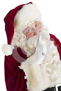 Portrait Of Santa Claus Making Silence Gesture