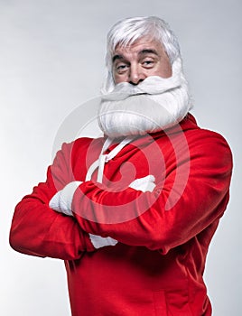 Portrait of a Santa Claus in sportsware with hands crossed