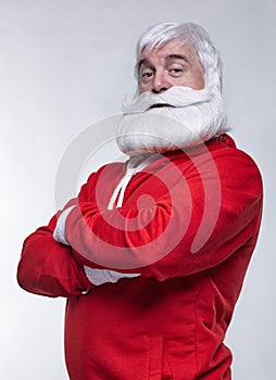 Portrait of a Santa Claus in sportsware with hands crossed