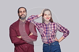 Portrait of satisfied bearded man and woman in casual style stan