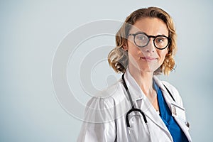 Portrait of satisfied and reliable mature female doctor