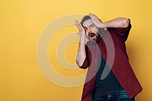 Portrait of Scared Screaming Bearded Man Hold Head