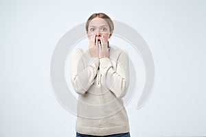 Portrait of the scared woman. Business woman standing isolated on trendy pink studio background.