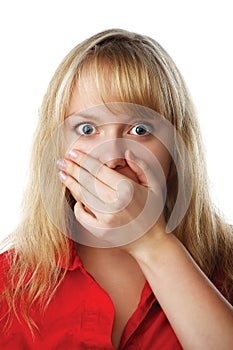 Portrait of scared woman covering mouth with hand