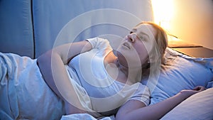 Portrait of scared young woman had nightmare at night
