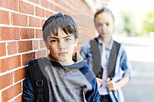 Portrait of school 10 years boy and girl having fun outside