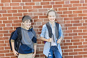 Portrait of school 10 years boy and girl having fun outside