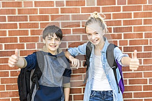 Portrait of school 10 years boy and girl having fun outside