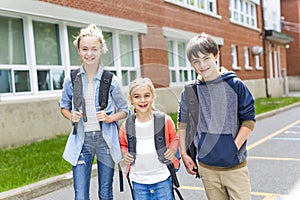 Portrait of school 10 years boy and girl having fun outside