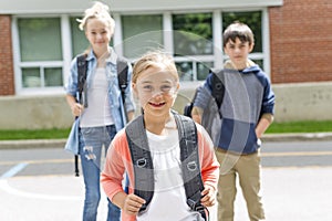 Portrait of school 10 years boy and girl having fun outside