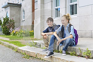 Portrait of school 10 years boy and girl having fun outside