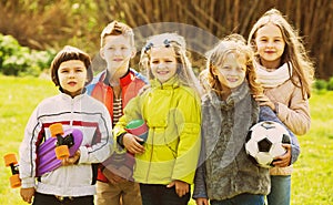 Portrait of school girls and boys playing