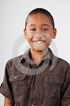 Portrait of schoolboy 9 with huge toothy smile