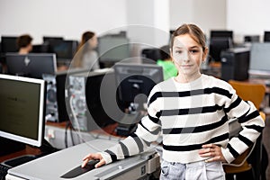 Portrait of schoolgirl girl in computer class at school