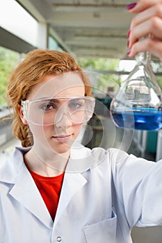 Portrait of a science student holding a flask