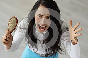 Portrait of screaming woman with severe hair loss closeup