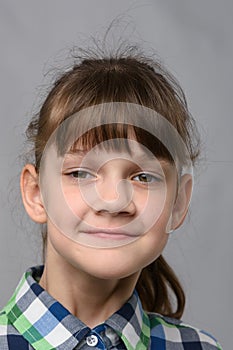 Portrait of a self-confident ten-year-old girl of European appearance, close-up