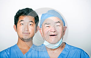 A portrait of Senior adult surgeon and a young Asian doctor