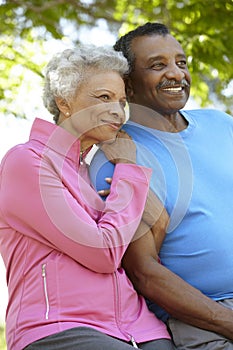 Portrait Of Senior African American Couple Wearing Running Clothing In Park