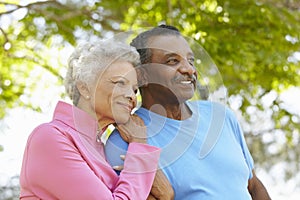 Portrait Of Senior African American Couple Wearing Running Clothing In Park