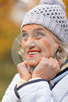 Portrait of senior beautiful woman in autumnal park