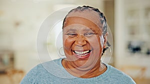 Portrait of senior black woman in home, laughing and relax with wellness, pride and confidence in apartment. Retirement