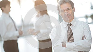 Portrait of a senior businessman on blurred background office