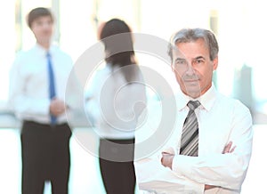 Portrait of a senior businessman on blurred background office
