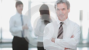 Portrait of a senior businessman on blurred background office