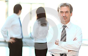 Portrait of a senior businessman on blurred background office