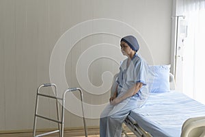 Portrait of senior cancer patient woman wearing head scarf in hospital, healthcare and medical concept