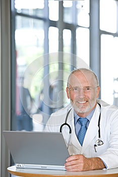 Portrait of a senior caring doctor