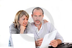 Portrait of senior couple doing paperwork