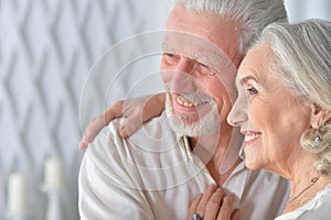 Portrait of senior couple hugging at home