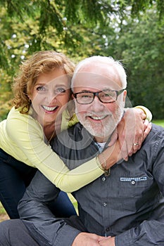 Portrait of a senior couple laughing together outdoors