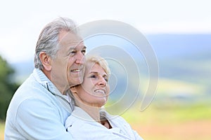 Portrait of senior couple looking towards future
