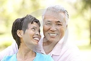 Portrait Of Senior Couple In Park