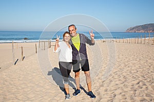 Portrait of senior couple posing for camera after training